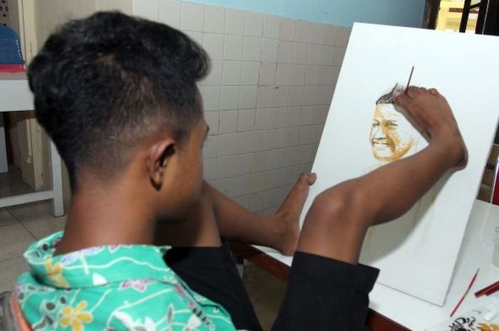 Seorang Anak Difabel dengan Bakat Melukisnya yang Memukau